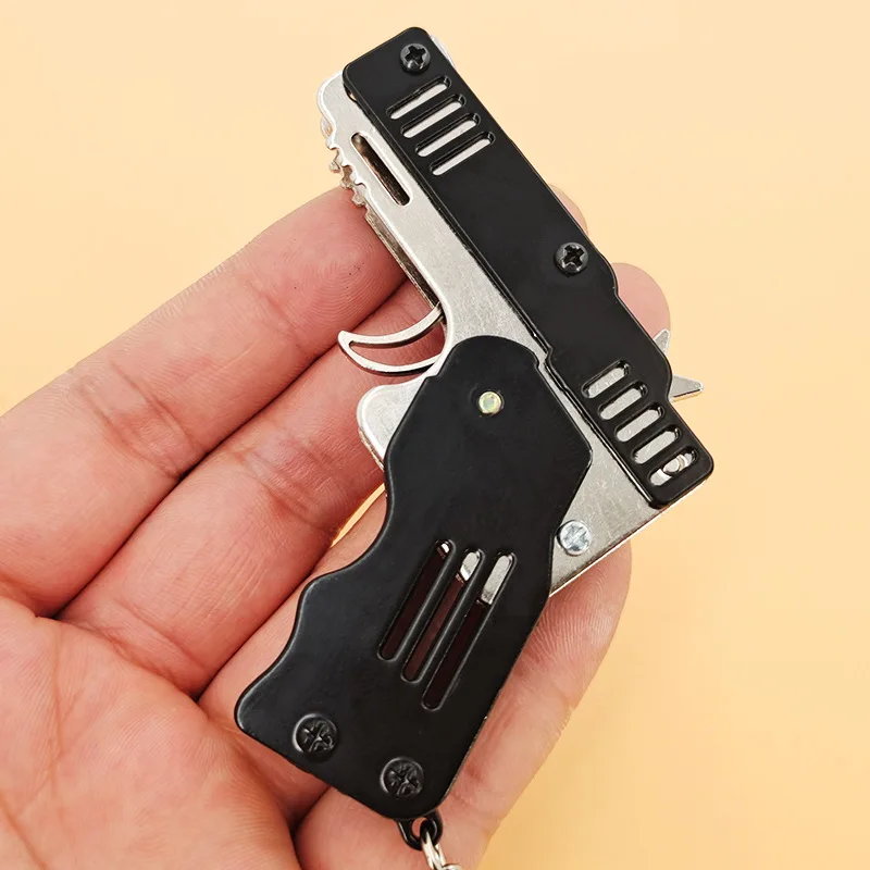 Mini Udendørs Folde værktøjer Nøglen Kæde Af elastik Pistol Byger Gjorde Alle Metal Kanoner Skyde Toy Gaver Drenge